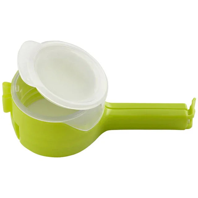 Green plastic kitchen tool with a white lid, multipurpose food gadget