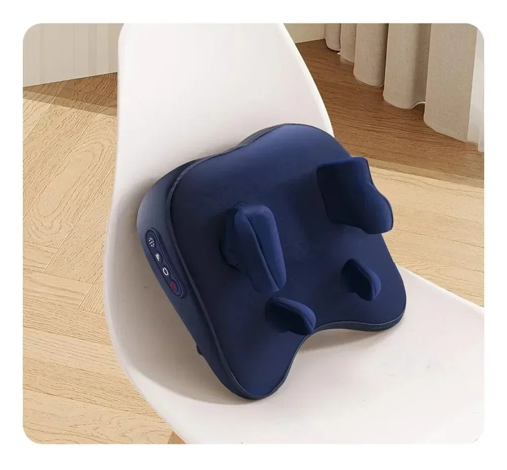 Navy blue ergonomic cushion with massage nodes and control panel on a white chair