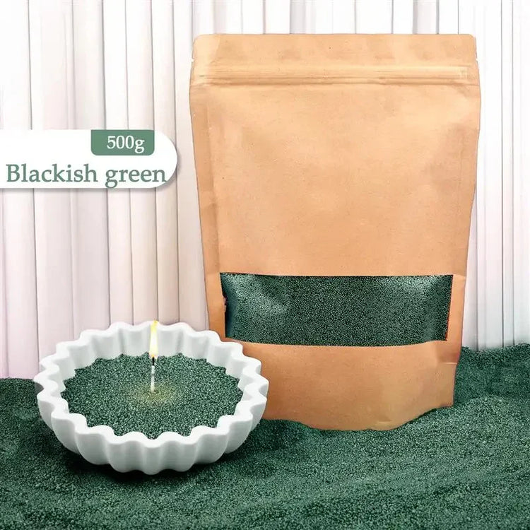 Blackish green incense sand in a brown resealable bag and white bowl, fine granular texture