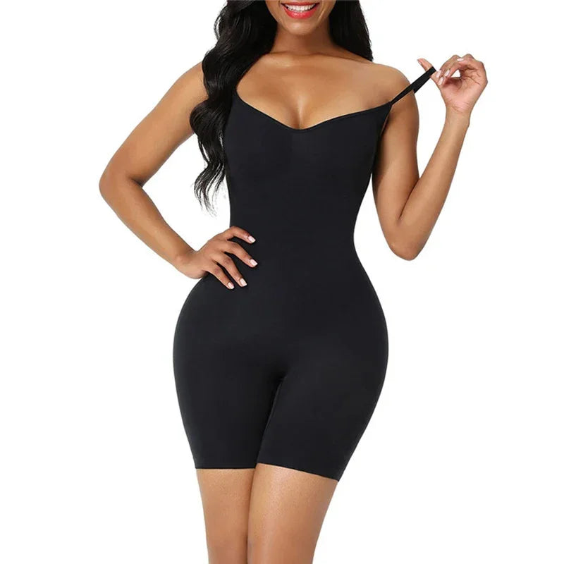 Woman wearing black seamless bodycon romper with adjustable straps, fitted silhouette