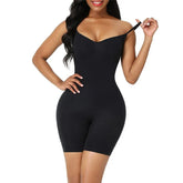 Woman wearing black seamless bodycon romper with adjustable straps, fitted silhouette