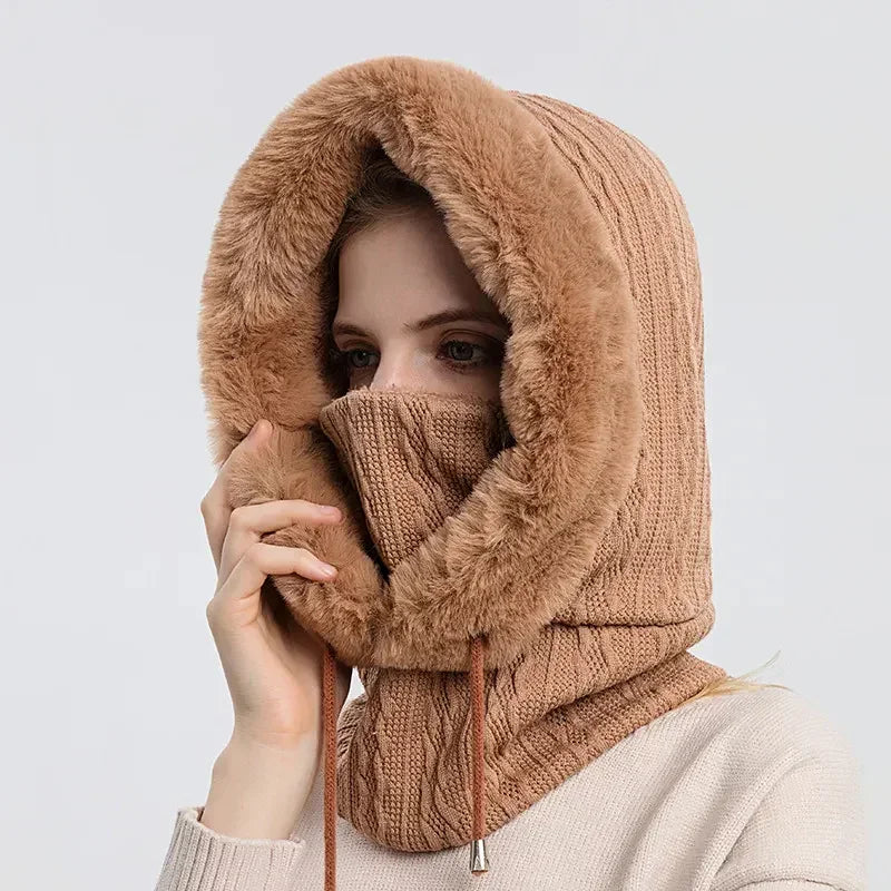 Woman wearing a thick brown knit hood with faux fur lining and face cover, winter fashion