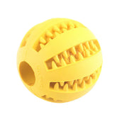 Yellow rubber ball with textured grooves and spikes, durable pet chew toy