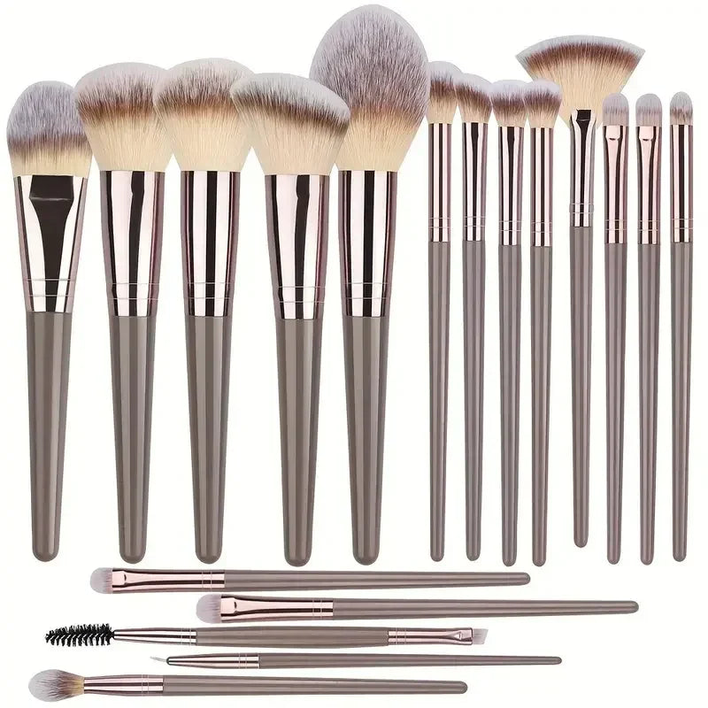 Set of 15 modern makeup brushes with soft synthetic bristles and sleek grey handles.