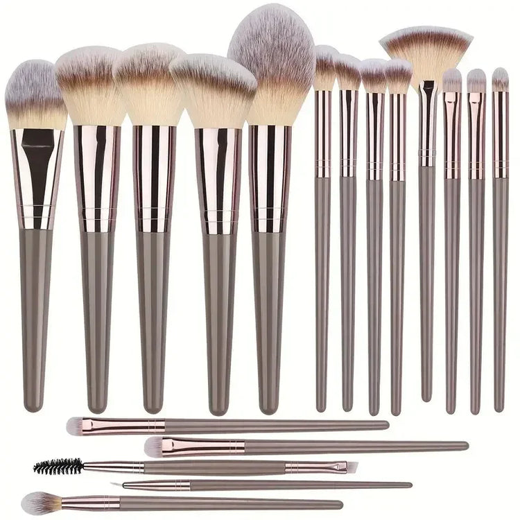 Set of 15 modern makeup brushes with soft synthetic bristles and sleek grey handles.