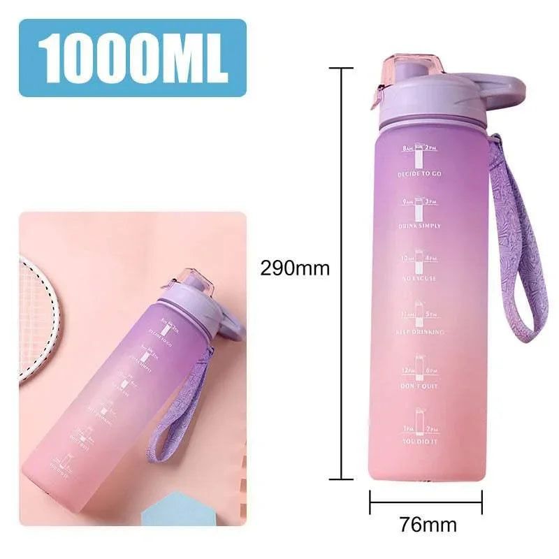 Gradient pink and purple 1000ml water bottle with motivational time markers, plastic build, carry strap, 290mm tall.