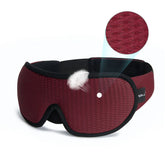 Burgundy textured sleep mask with black trim, soft breathable fabric, ergonomic fit
