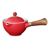 Red ceramic teapot with wooden handle and lid, modern minimalist design