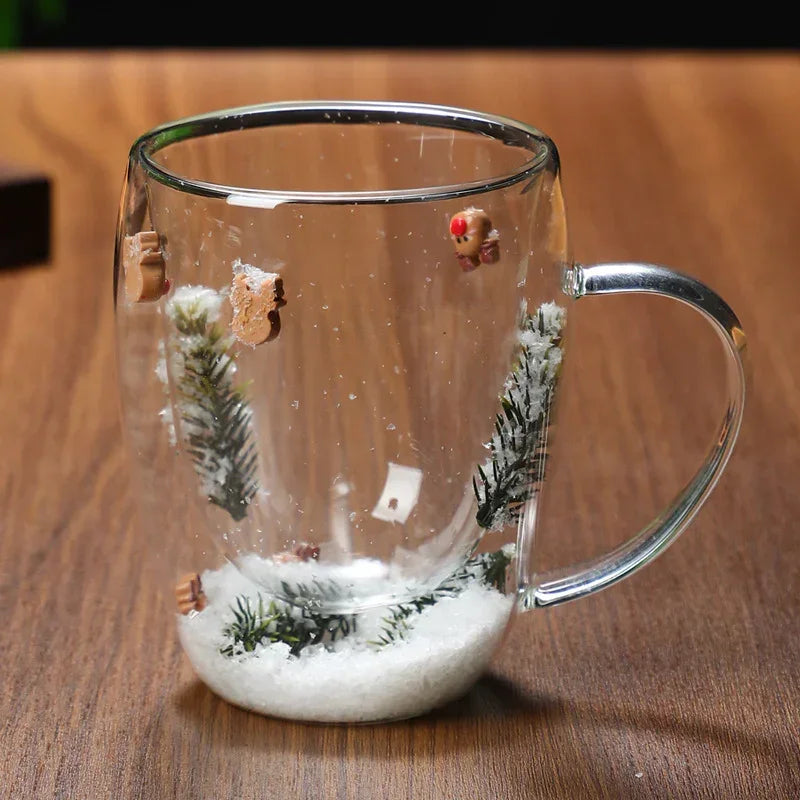 Clear glass mug with winter pine and snow design, decorative gingerbread accents
