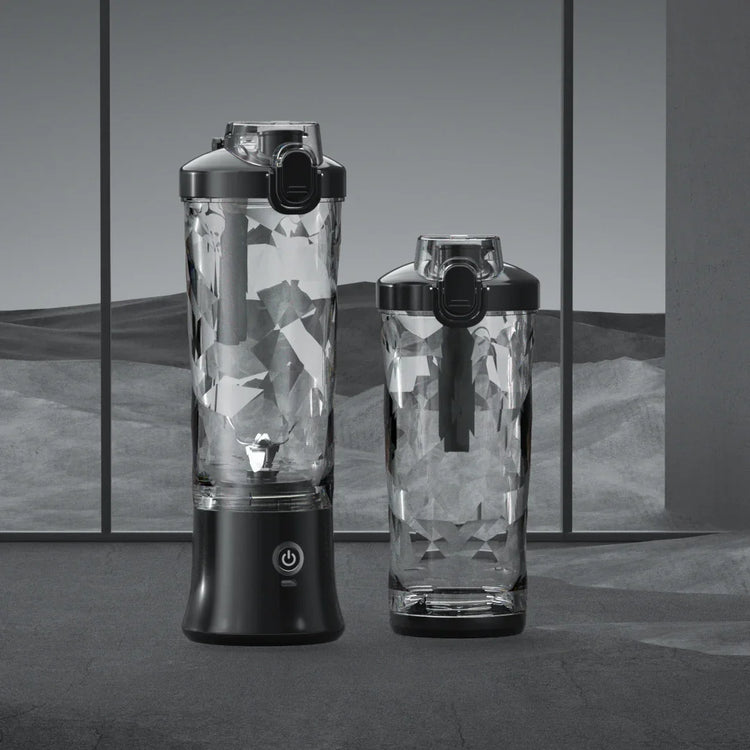 Two clear geometric-textured bottles with black lids, modern design on gray background