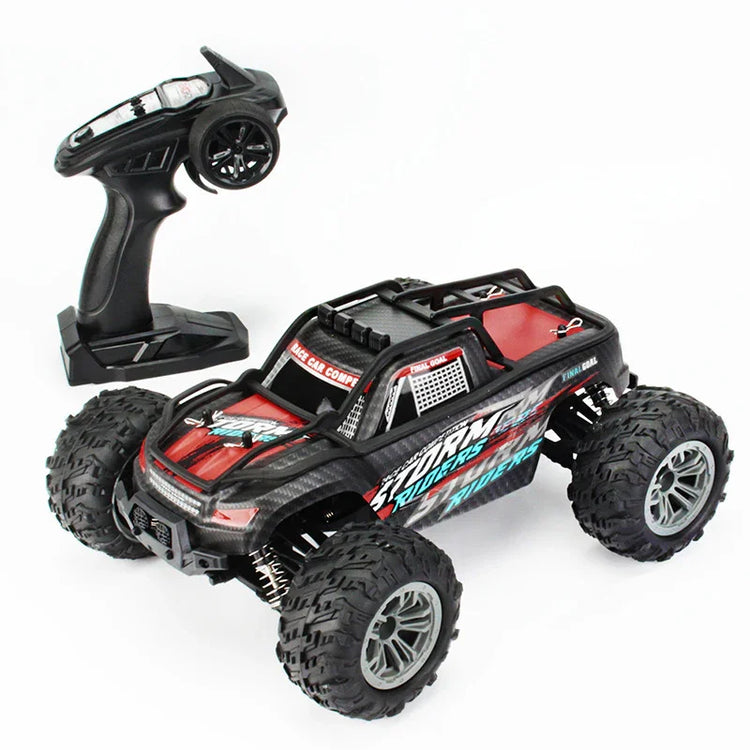 Red and black RC off-road truck with large tires and remote controller on white background