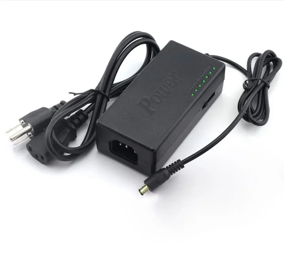 Black power adapter with green indicator lights and attached power cords on white background