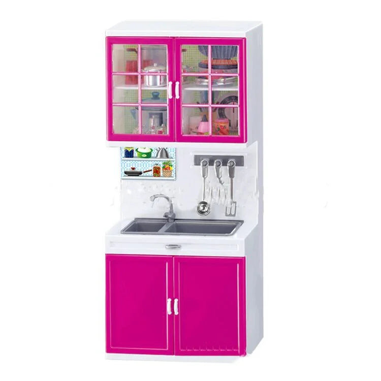 Miniature kitchen set with white and pink cabinets, sink, and utensil rack