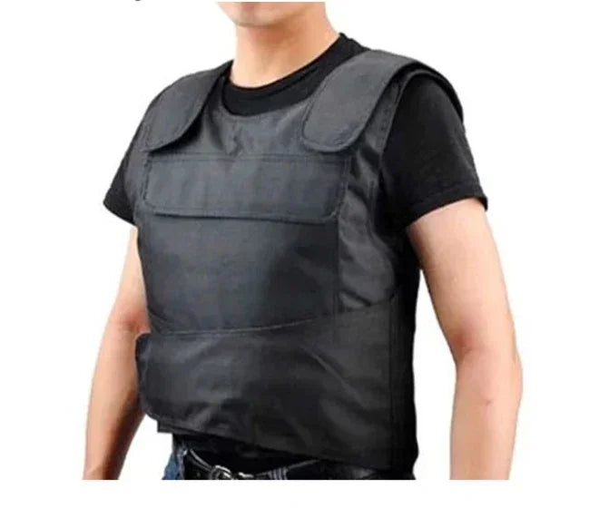 Black tactical vest with wide shoulder pads, durable material, regular fit, worn over black t-shirt