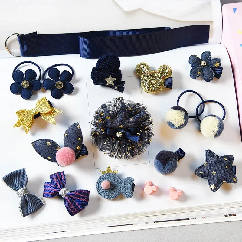 Assorted navy blue and gold hair clips and hair ties with stars, bows, and flower designs