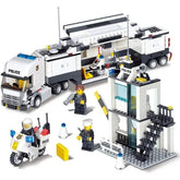 Block toy police station with mobile command truck, motorcycle, and three police figures.