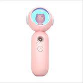 Pink handheld device with round glowing top featuring a cute cat face, modern plastic design