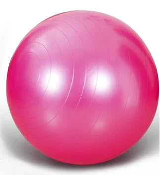 Bright pink exercise ball with smooth, glossy finish, fitness accessory for home workouts