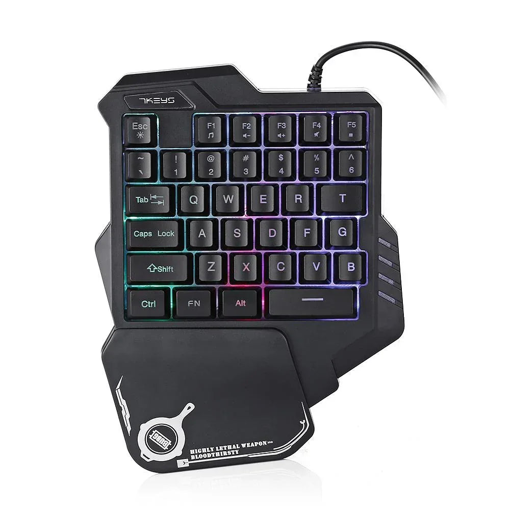 Compact black one-handed mechanical gaming keyboard with RGB backlighting and ergonomic wrist rest.