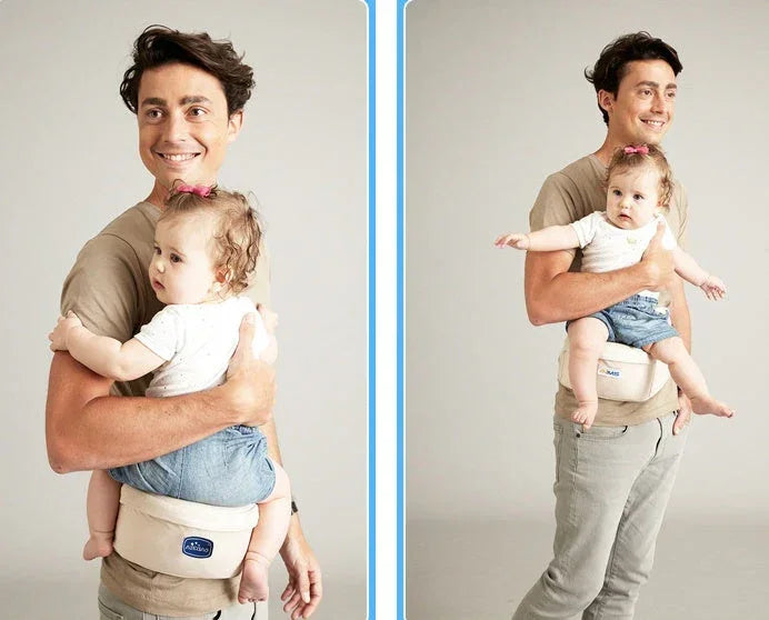 Man wearing beige hip seat carrier holding baby in white tee and denim shorts, casual fit