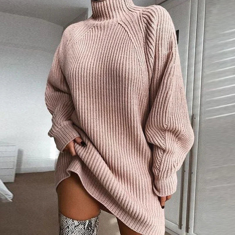 Oversized ribbed knit turtleneck sweater dress in light beige with relaxed fit and long sleeves.