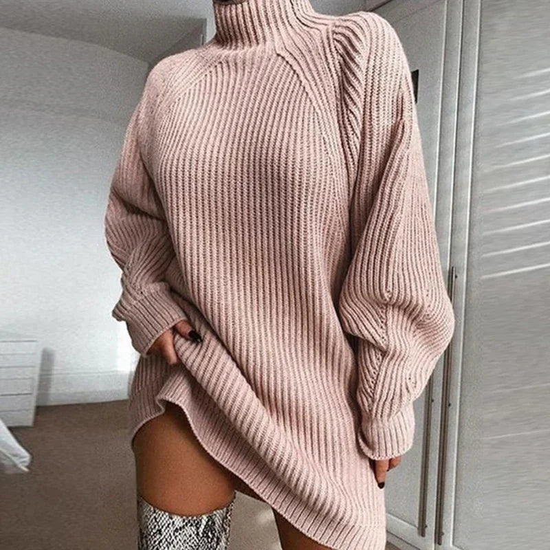 Oversized ribbed knit turtleneck sweater dress in light beige with relaxed fit and long sleeves.