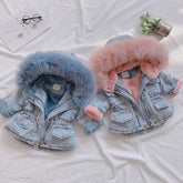 Light blue denim jackets with plush faux fur lining, one in blue, one in pink, hooded, relaxed fit.
