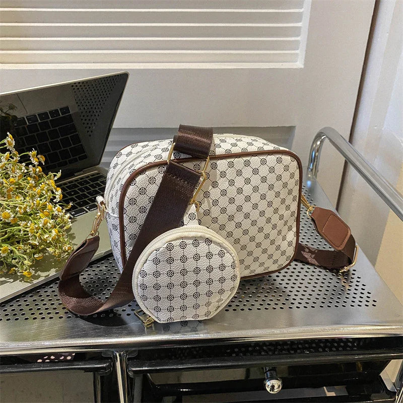 Monogram canvas crossbody bag with brown strap and round coin pouch, modern streetwear style.