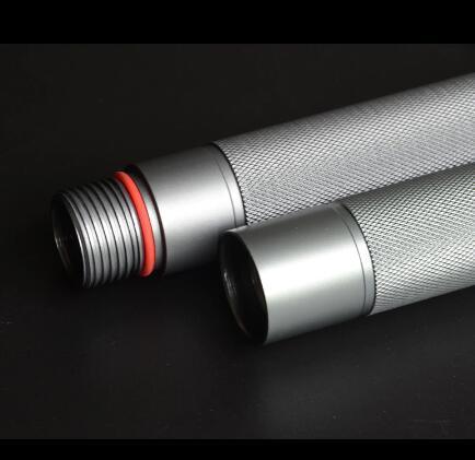 Close-up of two silver metal cylindrical rods with textured grip and threaded ends on black background.