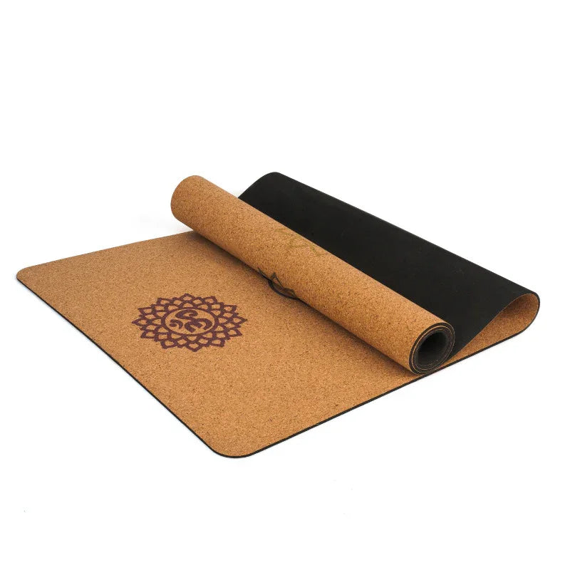 Cork yoga mat with black non-slip backing and geometric mandala design, unrolled on white background