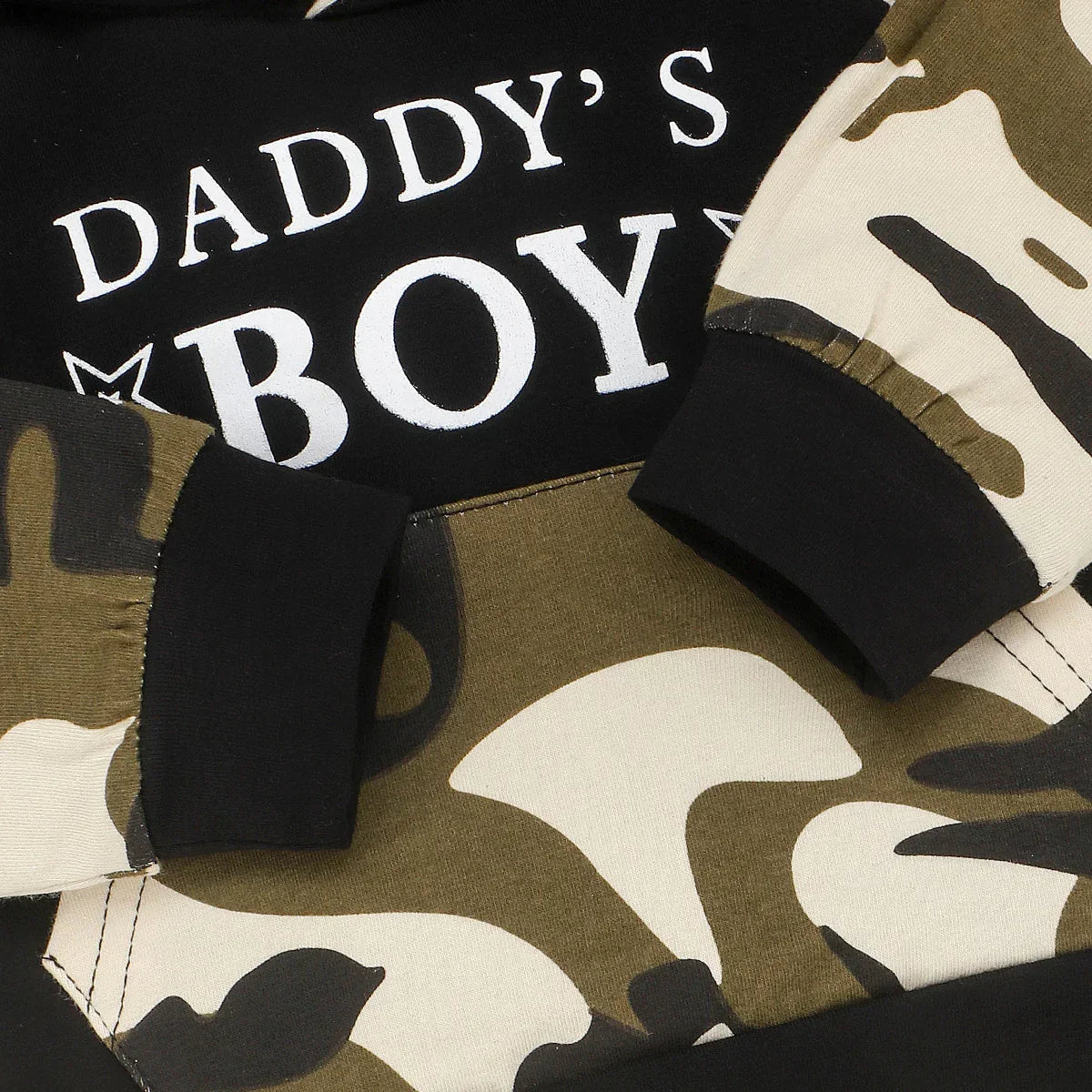 Black hoodie with white 'Daddy's Boy' print and green camo sleeves, cotton, relaxed fit.