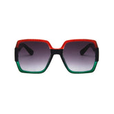 Oversized square sunglasses with red and green gradient frame, black arms, and tinted lenses