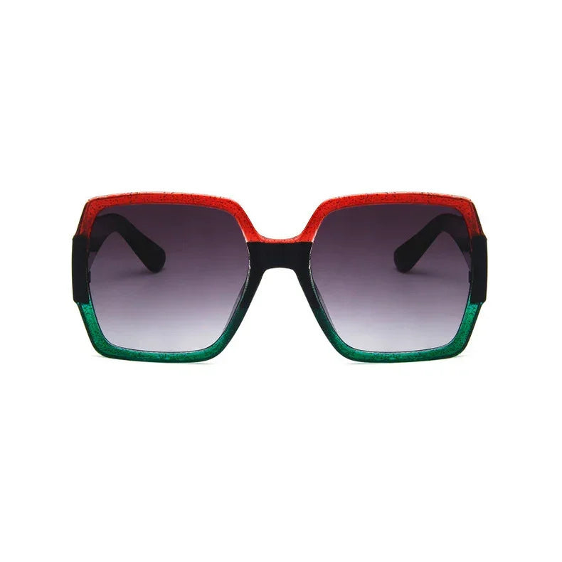 Oversized square sunglasses with red and green gradient frame, black arms, and tinted lenses