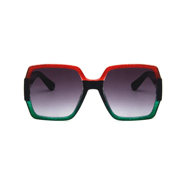 Oversized square sunglasses with red and green gradient frame, black arms, and tinted lenses