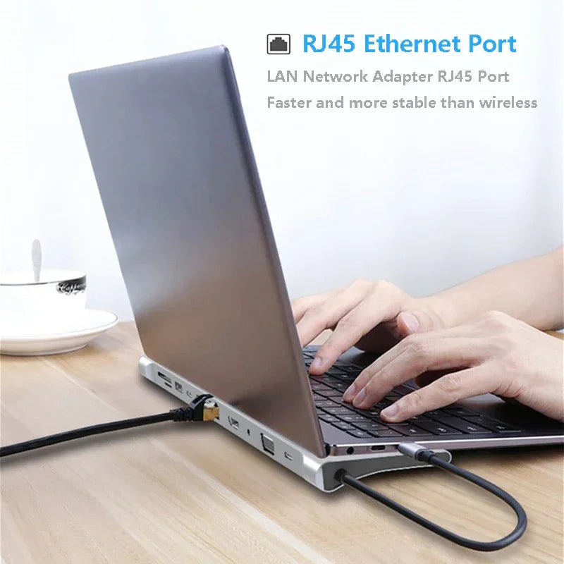 Laptop connected to RJ45 Ethernet port adapter on a wooden desk