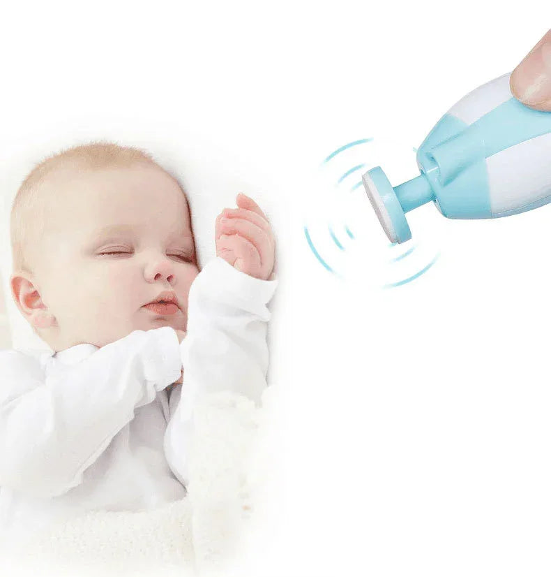 Baby in white cotton long sleeve sleepwear, soft relaxed fit, sleeping next to electric nail file
