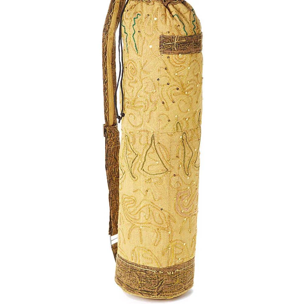 Handcrafted OMSutra yoga bag in beige with intricate embroidery and adjustable shoulder strap
