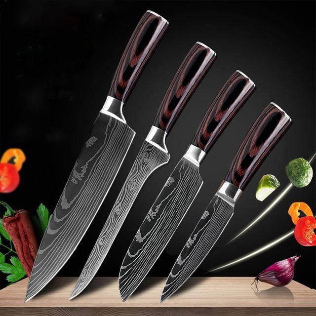 Set of four Damascus steel kitchen knives with wood handles on a cutting board, vegetables floating nearby.