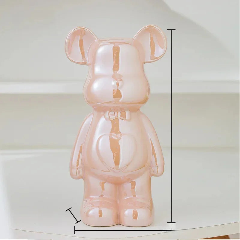 Glossy pink ceramic bear figurine with a bowtie, modern decor, measured for size
