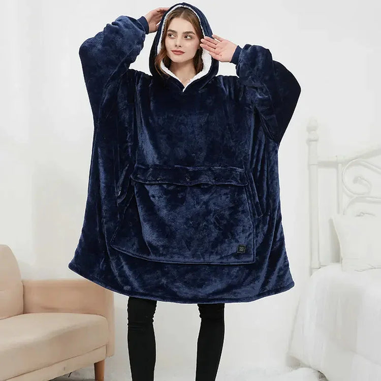 Woman wearing oversized navy blue plush hoodie blanket with front pocket, relaxed fit