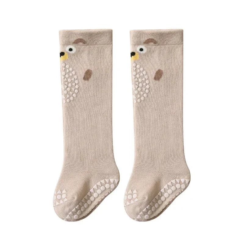 Beige knee-high socks with bear face design, non-slip soles, soft knit material, relaxed fit