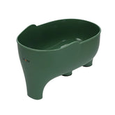 Green plastic elephant-shaped storage container with four legs and open top.