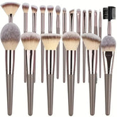 Set of metallic grey makeup brushes with soft synthetic bristles, various shapes and sizes