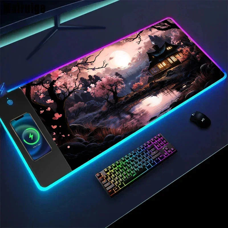 Large RGB LED gaming desk mat with cherry blossom nightscape, wireless charging, and soft fabric surface