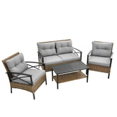 Four-piece outdoor patio set with gray cushions, rattan weave, black metal frame, includes coffee table