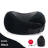 Black memory foam travel neck pillow with mesh lining, adjustable buckle strap, and storage bag