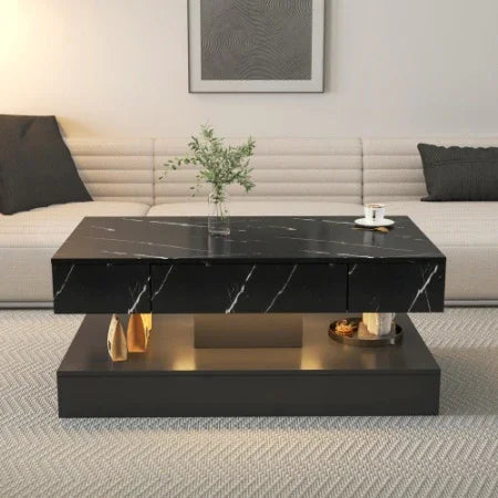 Modern living room with black marble coffee table, gold accents, and neutral sofa.