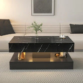 Modern living room with black marble coffee table, gold accents, and neutral sofa.