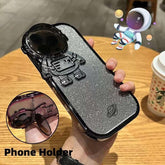 Glittery silver phone case with 3D astronaut design and built-in holder, sleek fit