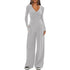 Woman wearing light gray long sleeve wrap top and wide leg pants lounge set